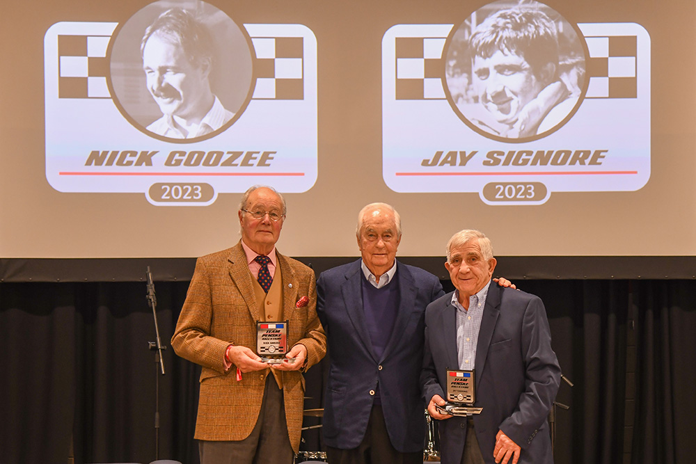 Nick Goozee (left) and Jay Signore (right) join Roger Penske at the 2023 Team Penske Hall of Fame induction ceremony
