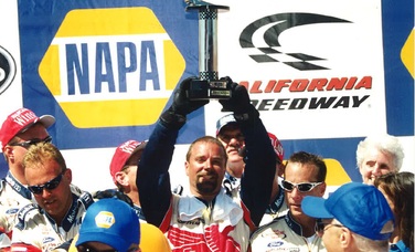 Jeffery Baker celebrates a win at California Speedway in the early 2000s